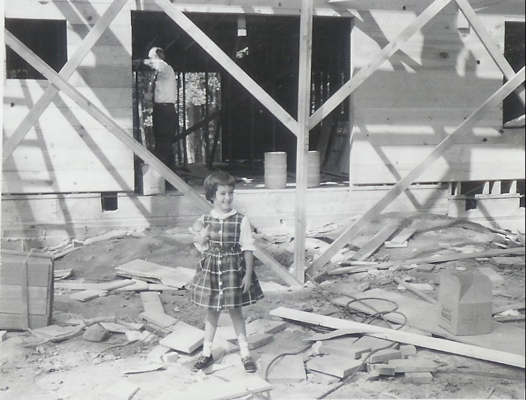 Perri Feldman as a child in front of her family's new home under construction in Short Hills, NJ